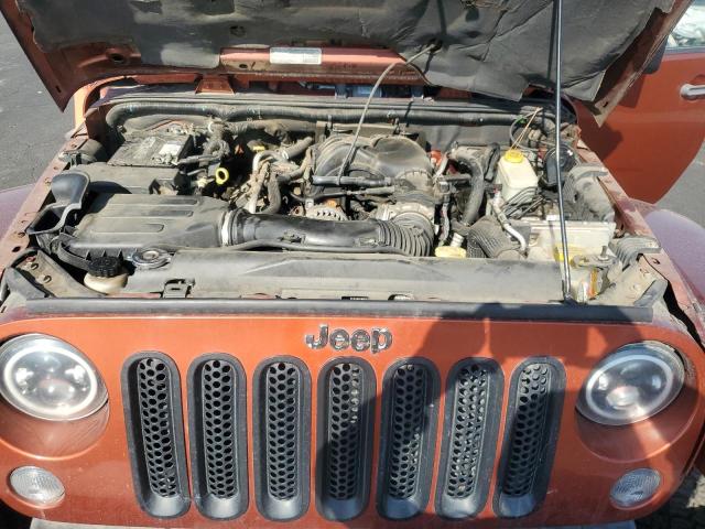 1C4BJWEG6EL258544 - 2014 JEEP WRANGLER U SAHARA ORANGE photo 12