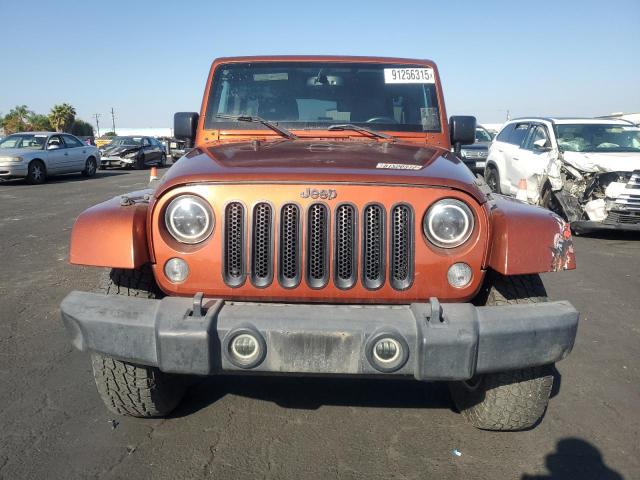1C4BJWEG6EL258544 - 2014 JEEP WRANGLER U SAHARA ORANGE photo 5