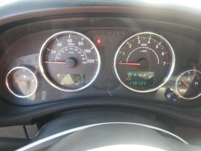 1C4BJWEG6EL258544 - 2014 JEEP WRANGLER U SAHARA ORANGE photo 9