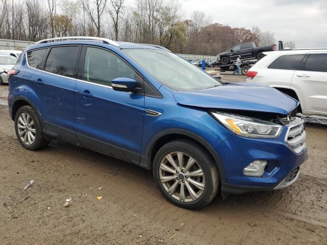 1FMCU9J95HUE03944 - 2017 FORD ESCAPE TITANIUM BLUE photo 4