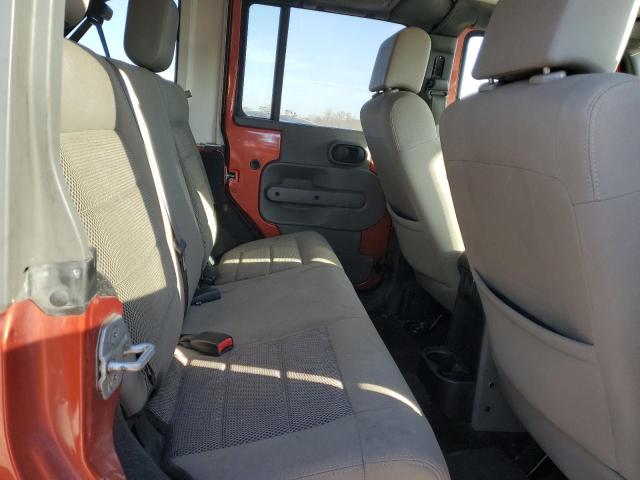 1J4GA59119L732082 - 2009 JEEP WRANGLER U SAHARA ORANGE photo 10