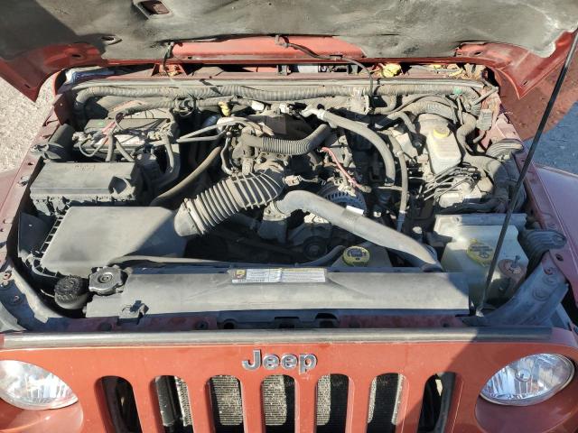 1J4GA59119L732082 - 2009 JEEP WRANGLER U SAHARA ORANGE photo 11