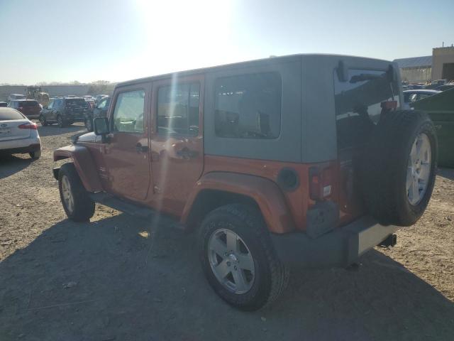 1J4GA59119L732082 - 2009 JEEP WRANGLER U SAHARA ORANGE photo 2