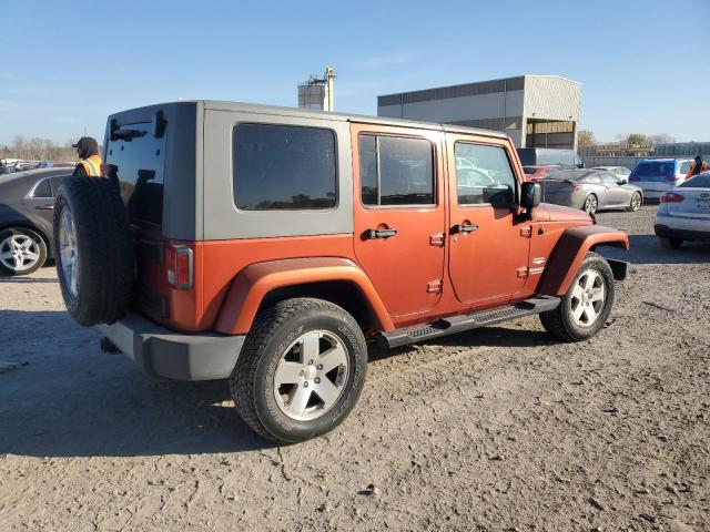 1J4GA59119L732082 - 2009 JEEP WRANGLER U SAHARA ORANGE photo 3