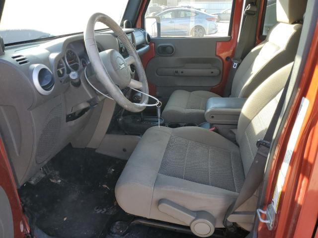 1J4GA59119L732082 - 2009 JEEP WRANGLER U SAHARA ORANGE photo 7