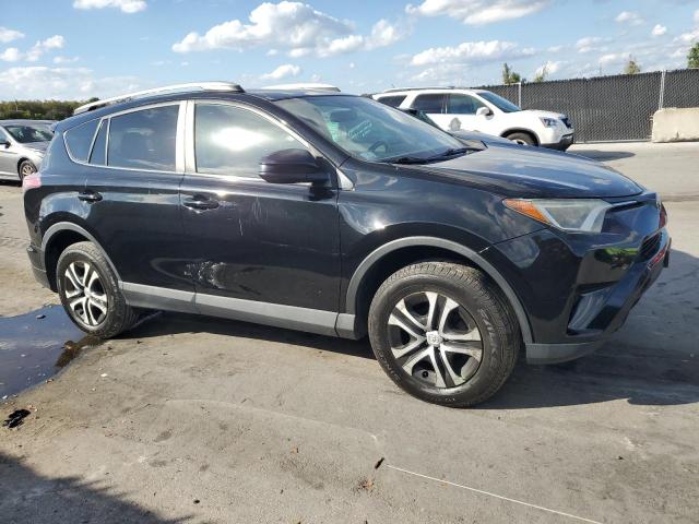 2T3BFREV5GW536402 - 2016 TOYOTA RAV4 LE BLACK photo 4