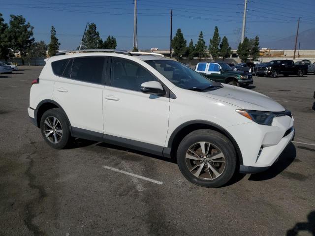 2T3WFREV6GW267201 - 2016 TOYOTA RAV4 XLE WHITE photo 4