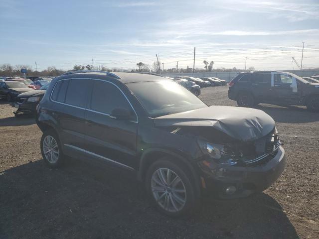 WVGAV7AX7GW528423 - 2016 VOLKSWAGEN TIGUAN S BLACK photo 4