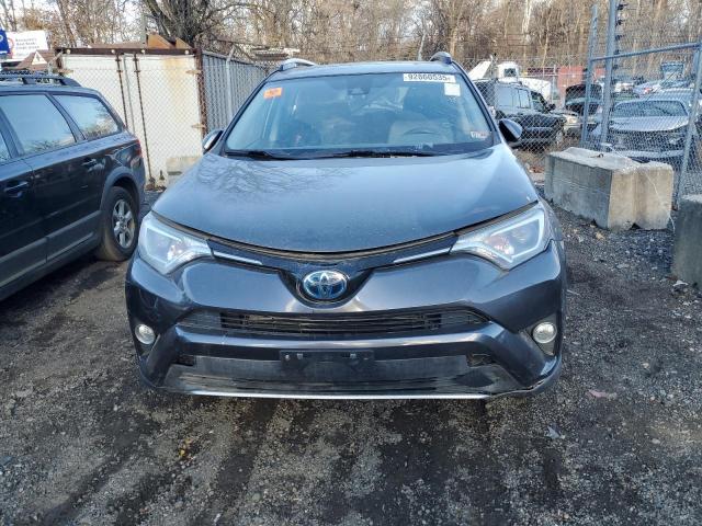 JTMRJREV6JD187137 - 2018 TOYOTA RAV4 HV LE Grau Foto 5