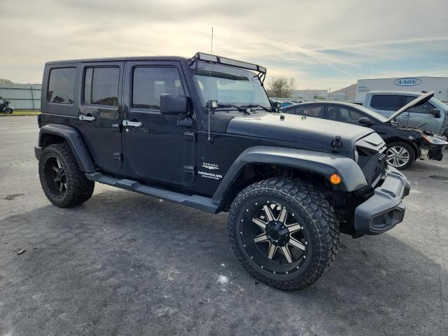 1J4GA59109L728993 - 2009 JEEP WRANGLER U SAHARA BLACK photo 4